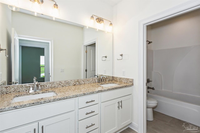 full bathroom with a sink, double vanity, toilet, and shower / tub combination