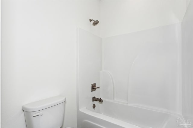 bathroom featuring toilet and  shower combination