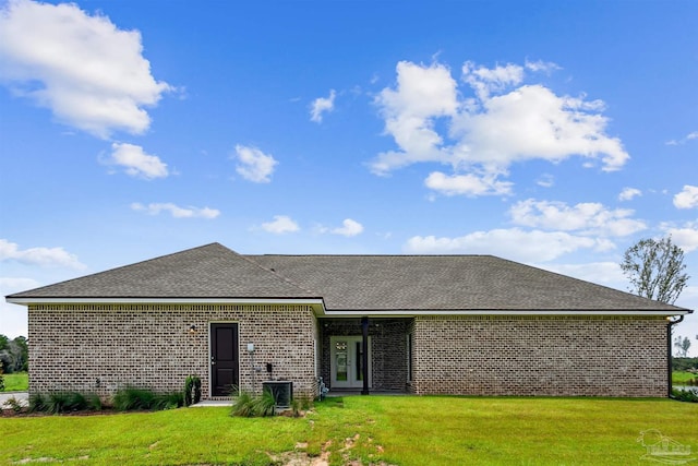 3975 Morning Dew Dr, Milton, FL 32583 - back of property with a lawn, a shingled roof, and brick siding