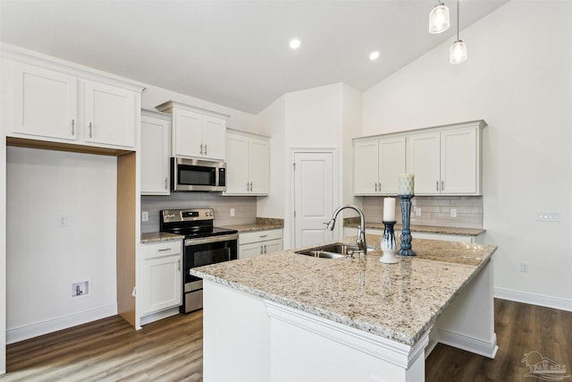 kitchen with a sink, appliances with stainless steel finishes, backsplash, and dark wood-style floors