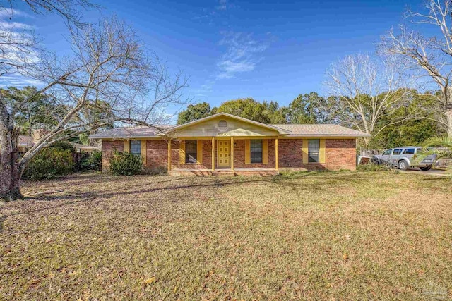 single story home with covered porch and a front yard