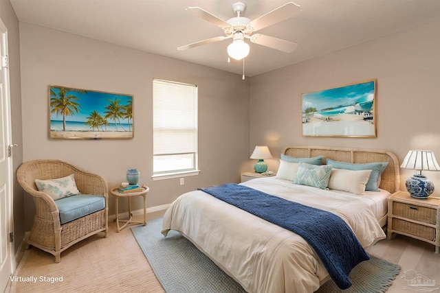 bedroom with light colored carpet and ceiling fan