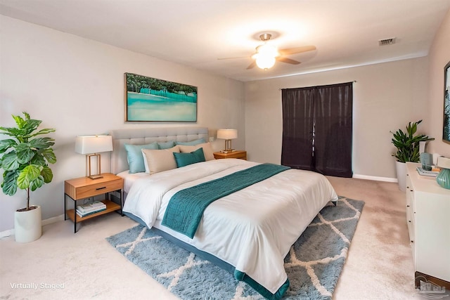 bedroom featuring light carpet and ceiling fan