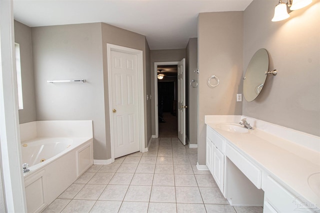 bathroom with vanity, a bathtub, and tile patterned floors