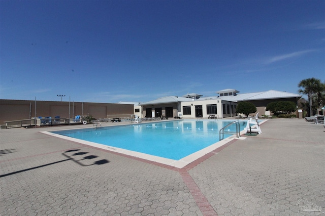 view of pool featuring a patio