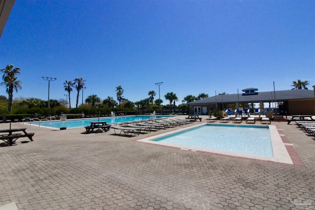 view of swimming pool featuring a patio area