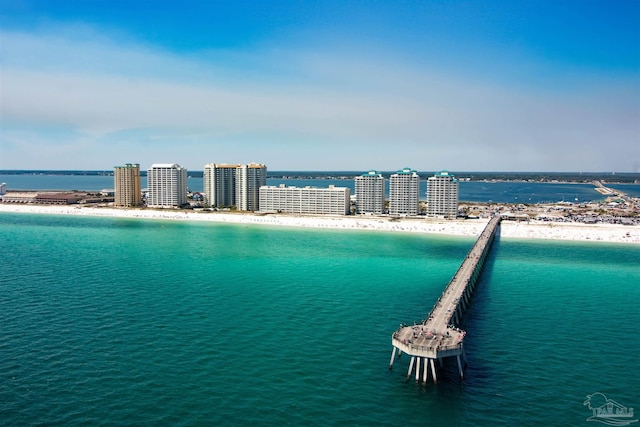 bird's eye view featuring a water view and a view of the beach