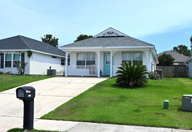 5577 Shadow Shore Pl, Gulf Breeze, FL 32563 - view of front of home with covered porch, a shingled roof, central AC, and driveway