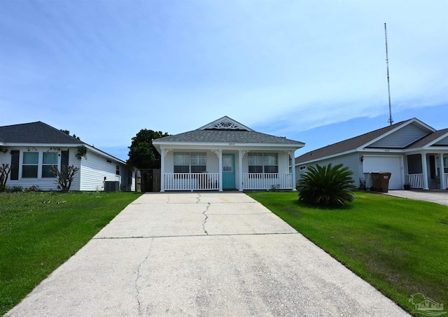 5577 Shadow Shore Pl, Gulf Breeze, FL 32563 - view of front facade with a porch, concrete driveway, a front yard, and central air condition unit