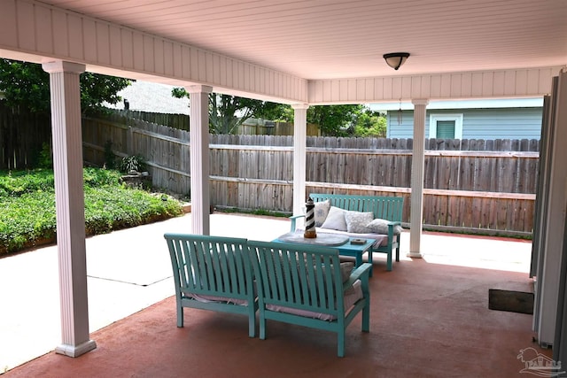 5577 Shadow Shore Pl, Gulf Breeze, FL 32563 - fenced backyard featuring a patio area and an outdoor living space