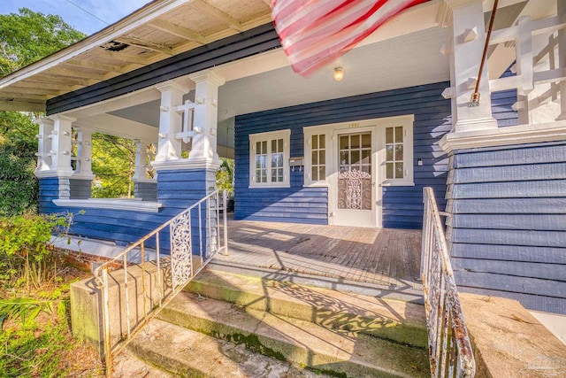 doorway to property featuring covered porch