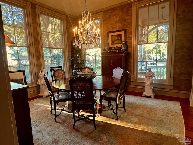 dining room with a healthy amount of sunlight and an inviting chandelier