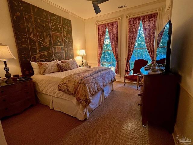 carpeted bedroom with ornamental molding, access to outside, visible vents, and a ceiling fan