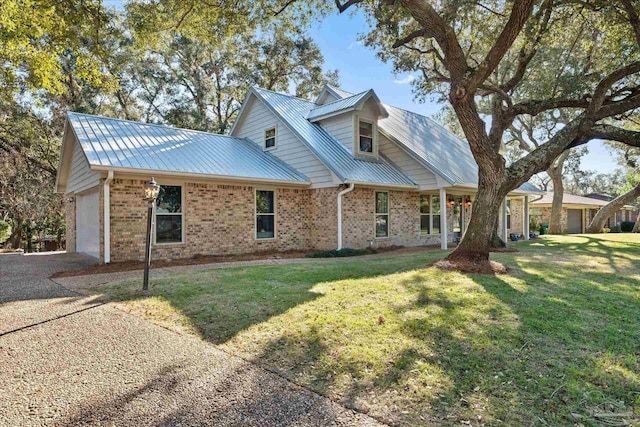 exterior space featuring a front lawn and a garage