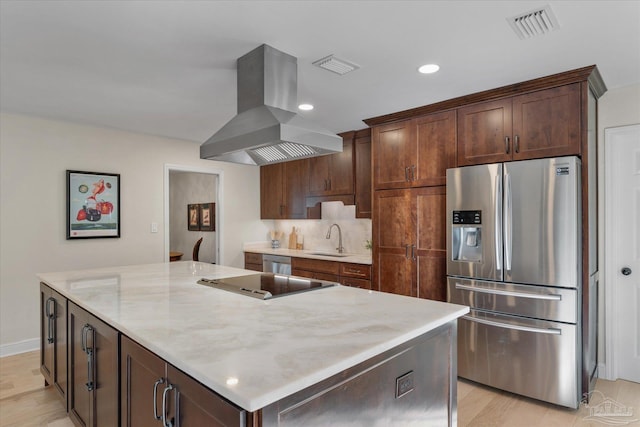 kitchen featuring island range hood, sink, a kitchen island, and appliances with stainless steel finishes