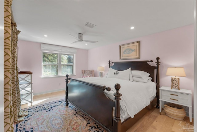 bedroom featuring light hardwood / wood-style floors and ceiling fan