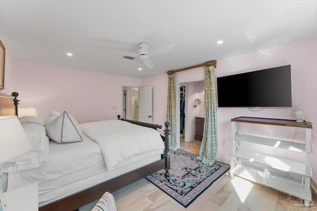 bedroom with ceiling fan and light hardwood / wood-style flooring