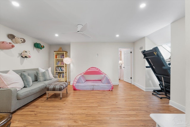 interior space with ceiling fan and light hardwood / wood-style flooring