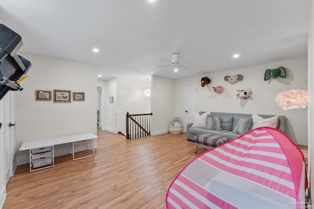 bedroom featuring ceiling fan and light hardwood / wood-style flooring