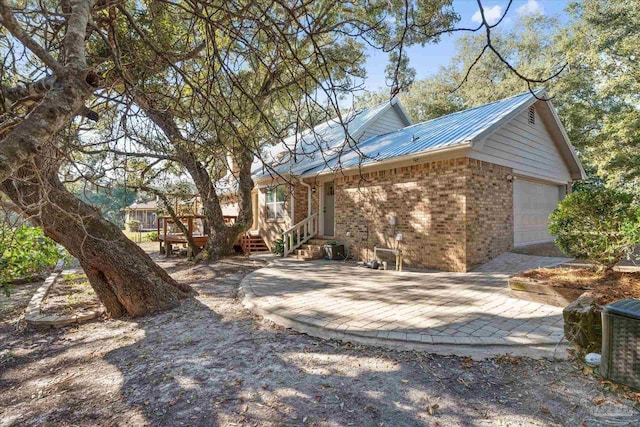 view of side of property with a garage