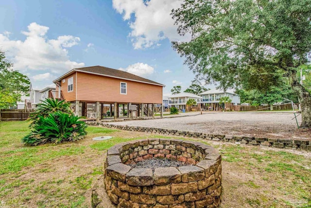 view of yard with an outdoor fire pit