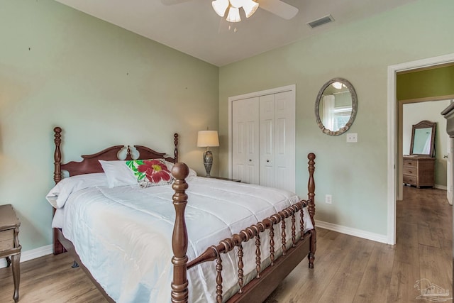 5473 Pensacola Ave, Orange Beach, AL 36561 - bedroom with baseboards, wood finished floors, a closet, and a ceiling fan