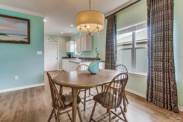 5473 Pensacola Ave, Orange Beach, AL 36561 - dining room featuring ornamental molding, baseboards, light wood-style flooring, and recessed lighting