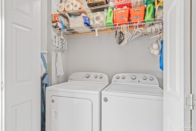 laundry area with washing machine and clothes dryer