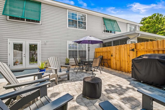 view of patio featuring french doors and a grill