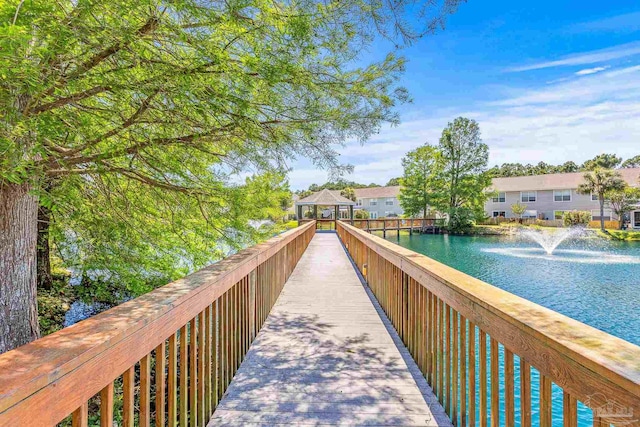 view of community featuring a gazebo and a water view