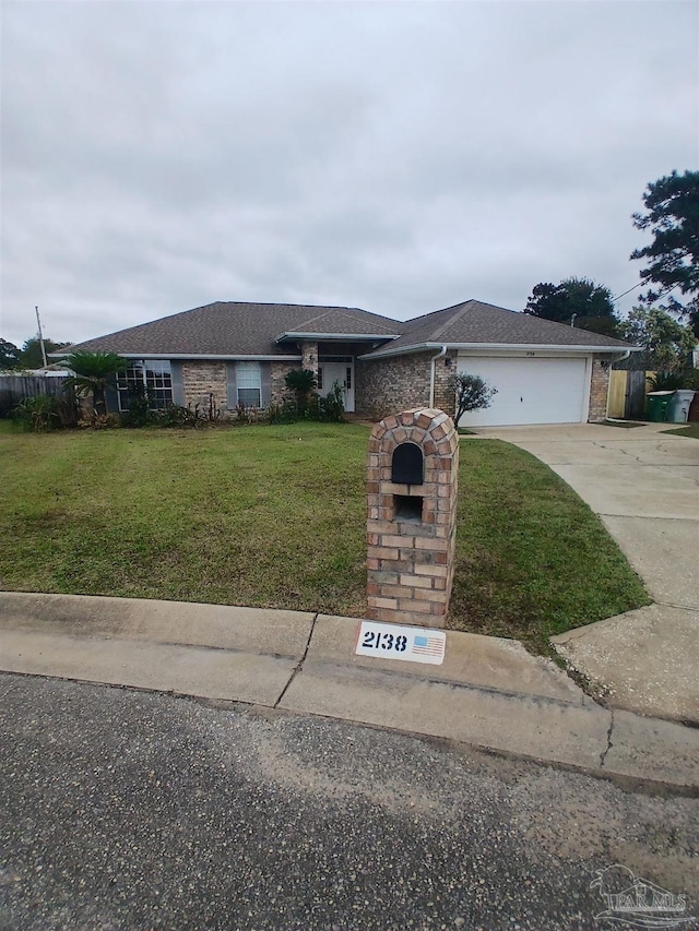 view of front of home with a garage and a front lawn