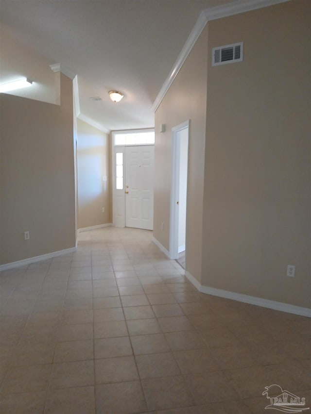 tiled foyer with ornamental molding