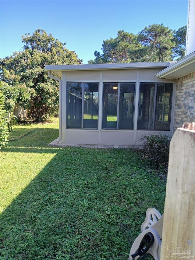 view of yard with a sunroom