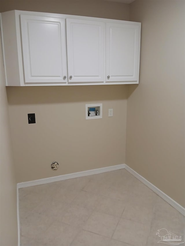 washroom featuring gas dryer hookup, hookup for a washing machine, cabinets, and hookup for an electric dryer