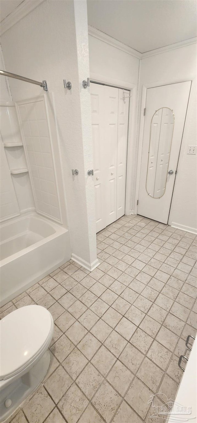 bathroom featuring ornamental molding, toilet, and shower / washtub combination