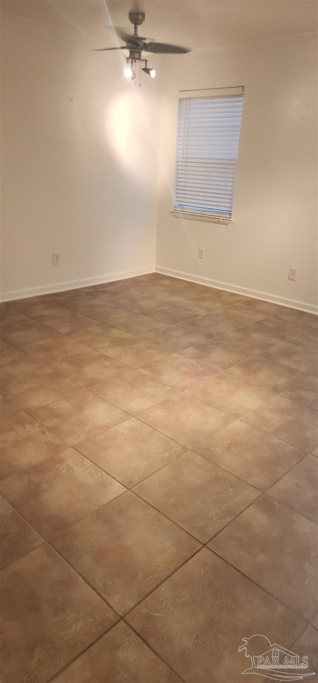 spare room with ceiling fan