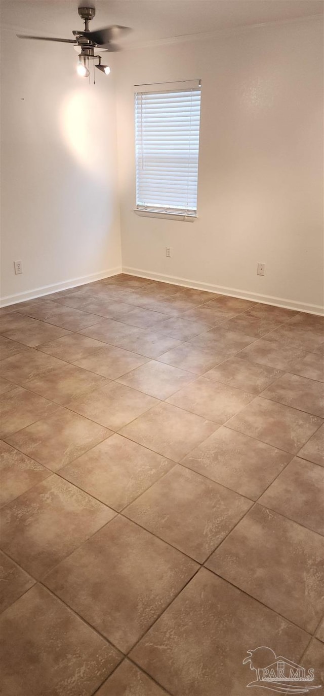 unfurnished room with ceiling fan