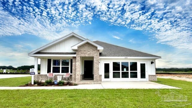 2713 Chevy Cir, Pace, FL 32571 - view of front facade with a garage and a yard