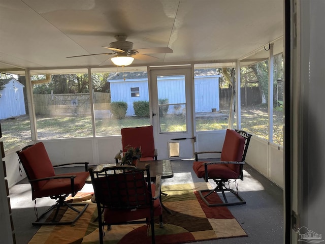 sunroom featuring a wealth of natural light and ceiling fan