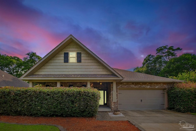 5811 Rustic Ridge Cir, Milton, FL 32570 - view of front facade with a garage, driveway, and a shingled roof