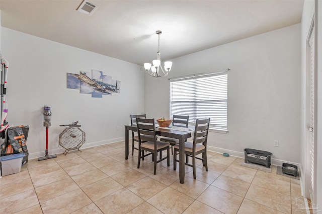 5811 Rustic Ridge Cir, Milton, FL 32570 - dining space with a chandelier, light tile patterned floors, and baseboards