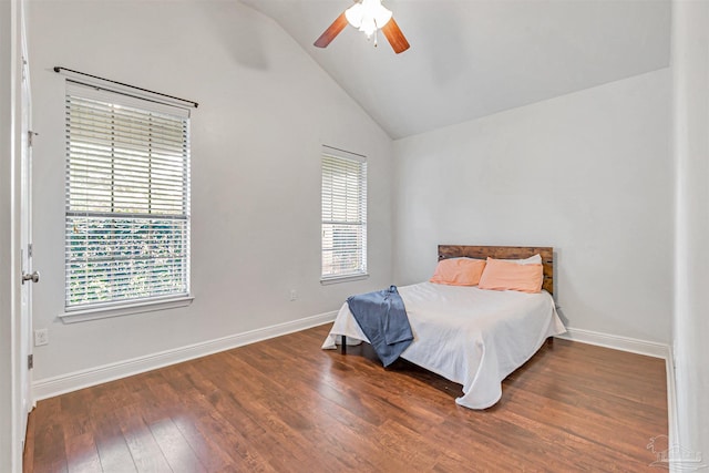 5811 Rustic Ridge Cir, Milton, FL 32570 - bedroom with lofted ceiling, wood finished floors, baseboards, and a ceiling fan