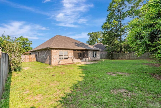 5811 Rustic Ridge Cir, Milton, FL 32570 - rear view of property featuring brick siding and roof with shingles