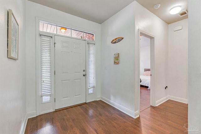 5811 Rustic Ridge Cir, Milton, FL 32570 - entryway featuring dark wood finished floors and baseboards