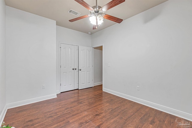 5811 Rustic Ridge Cir, Milton, FL 32570 - unfurnished bedroom featuring baseboards, wood finished floors, a closet, and ceiling fan