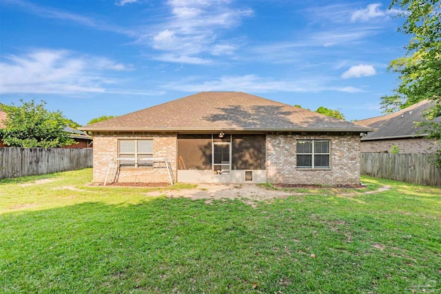 5811 Rustic Ridge Cir, Milton, FL 32570 - rear view of house featuring brick siding, a sunroom, and a shingled roof