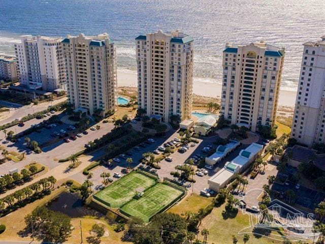 drone / aerial view featuring a water view and a view of city