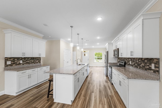 kitchen featuring white cabinetry, light wood-style floors, and appliances with stainless steel finishes