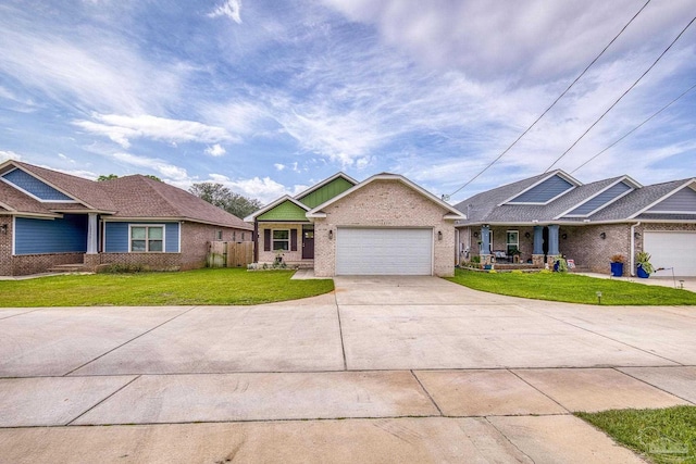 view of front of property featuring an attached garage, a front lawn, brick siding, and concrete driveway