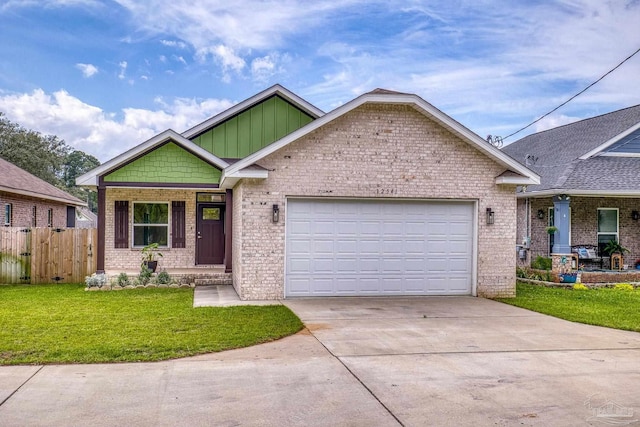 view of front of home featuring an attached garage, a front yard, fence, and driveway